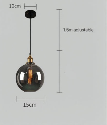 Smoky grey glass globe pendant light with brass Edison fitting and black cord, showing 15cm diameter and 1.5m adjustable cord on a grey background — LivDecor
