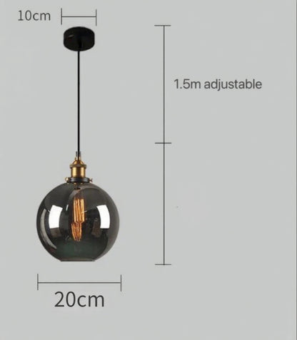 Smoky grey glass globe pendant light with brass Edison fitting and black cord, showing 20cm diameter and 1.5m adjustable cord on a grey background — LivDecor
