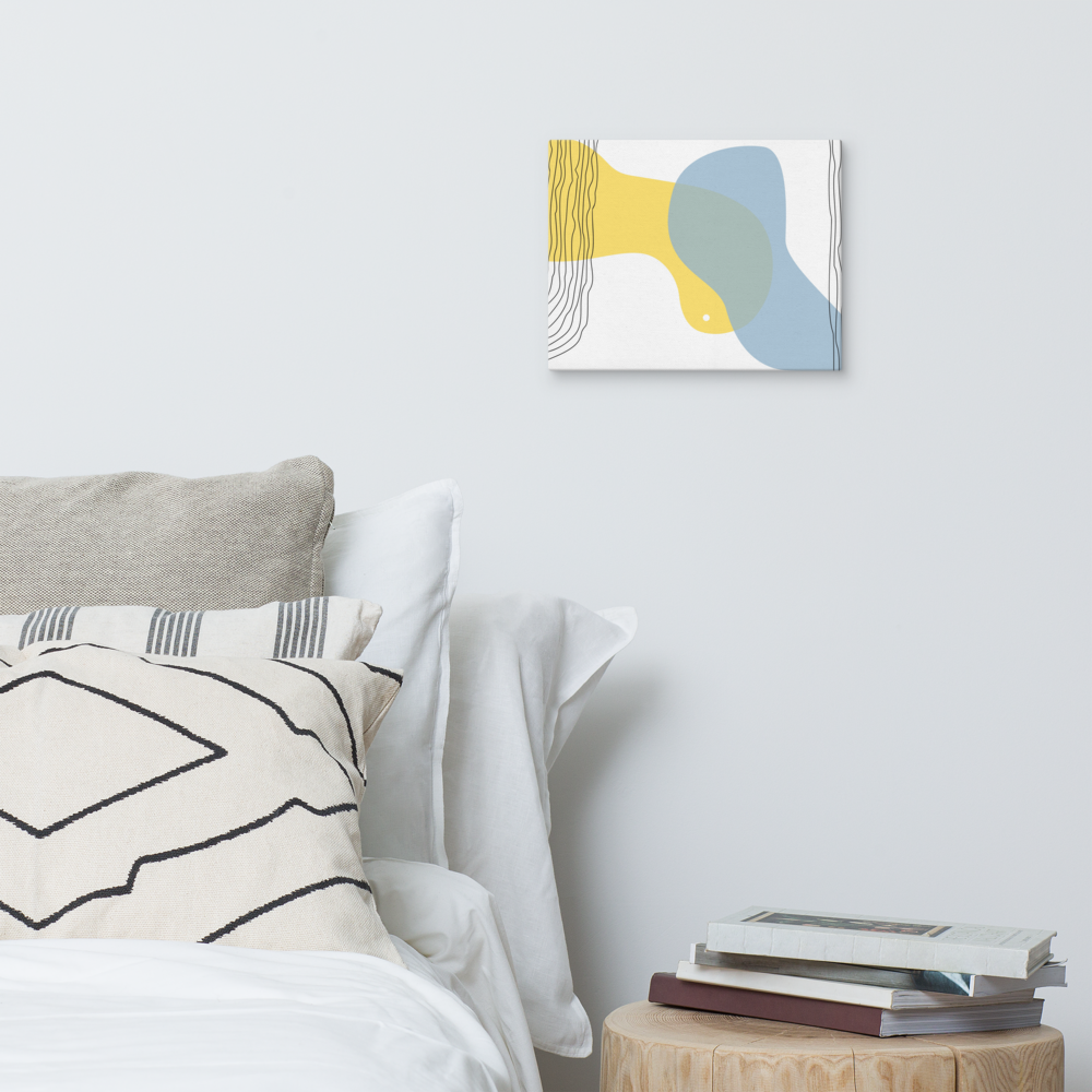 Sun & Shore abstract canvas print in 11×14 hung on a white bedroom wall beside a wood stump nightstand with stacked books and neutral linen bedding — LivDecor
