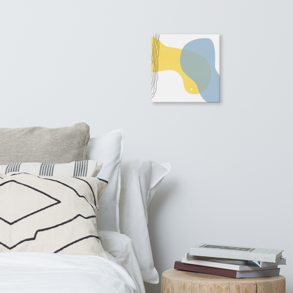Sun & Shore abstract canvas print in 12×12 square hung on a white bedroom wall beside a wood stump nightstand with stacked books and neutral linen bedding — LivDecor
