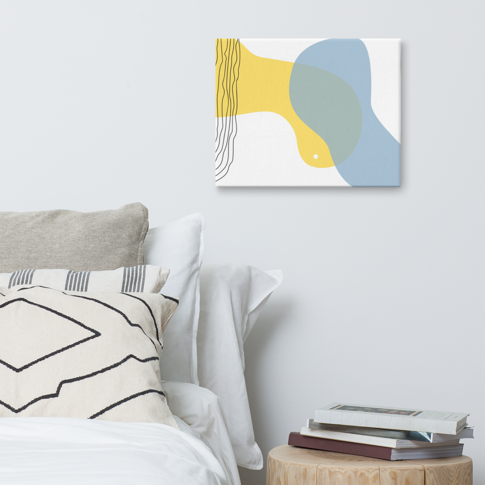 Sun & Shore abstract canvas print in 16×20 hung on a white bedroom wall beside a wood stump nightstand with stacked books and neutral linen bedding — LivDecor
