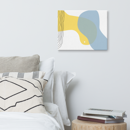 Sun & Shore abstract canvas print in 16×20 hung on a white bedroom wall beside a wood stump nightstand with stacked books and neutral linen bedding — LivDecor
