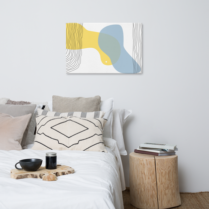 Sun & Shore abstract canvas print in 24×36 hung above a styled bed with neutral linen bedding, wood stump side table, and black ceramic accents in a bright minimalist bedroom — LivDecor
