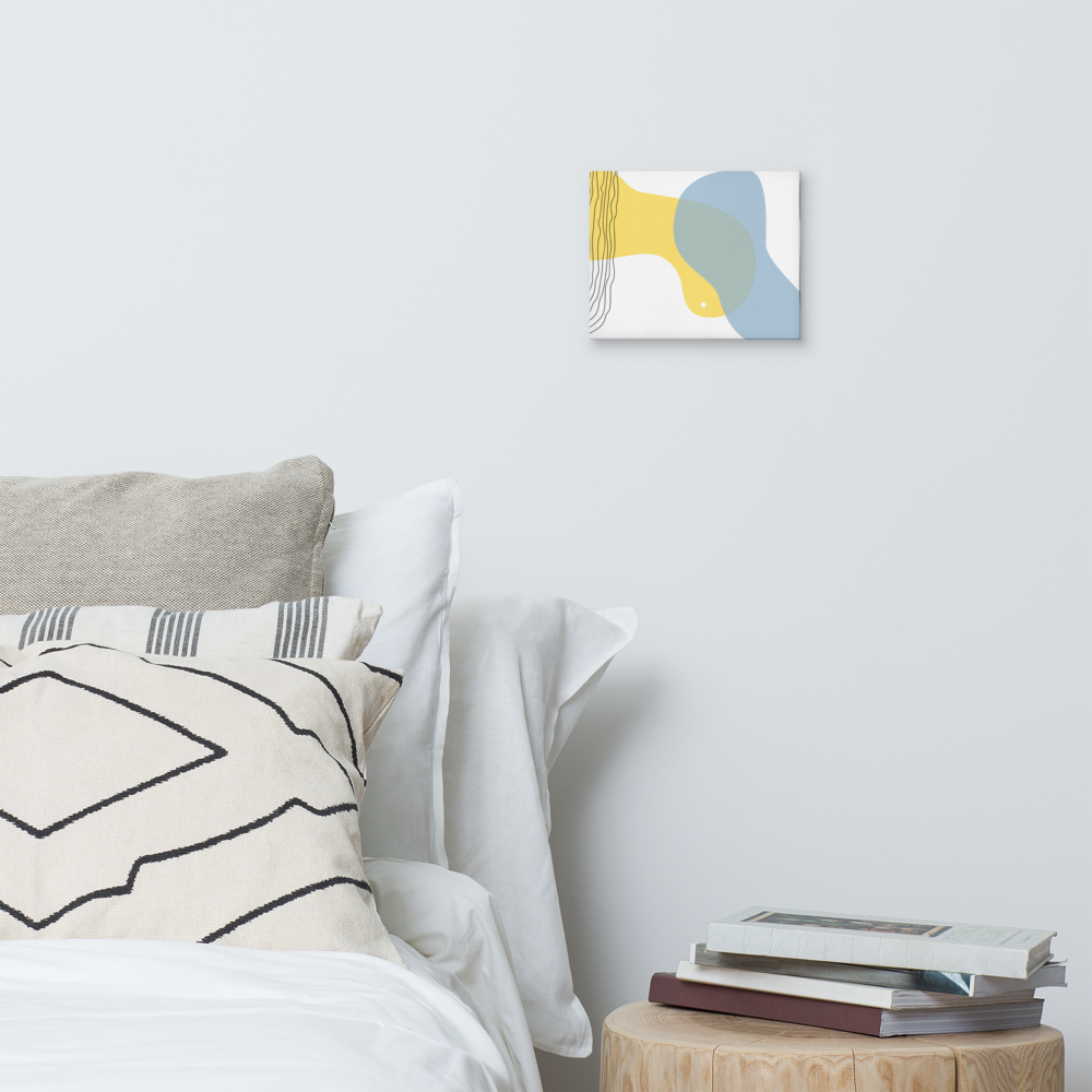 Sun & Shore abstract canvas print in 8×10 hung on a white bedroom wall beside a wood stump nightstand with stacked books and neutral linen bedding — LivDecor
