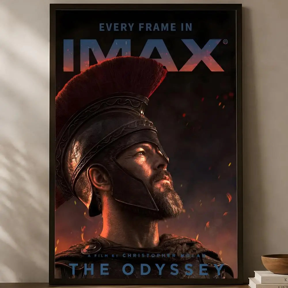 The Odyssey Christopher Nolan official IMAX every frame bearded warrior in red-plumed helmet with ember sparks cinematic poster displayed on a warm natural light shelf — LivDecor
