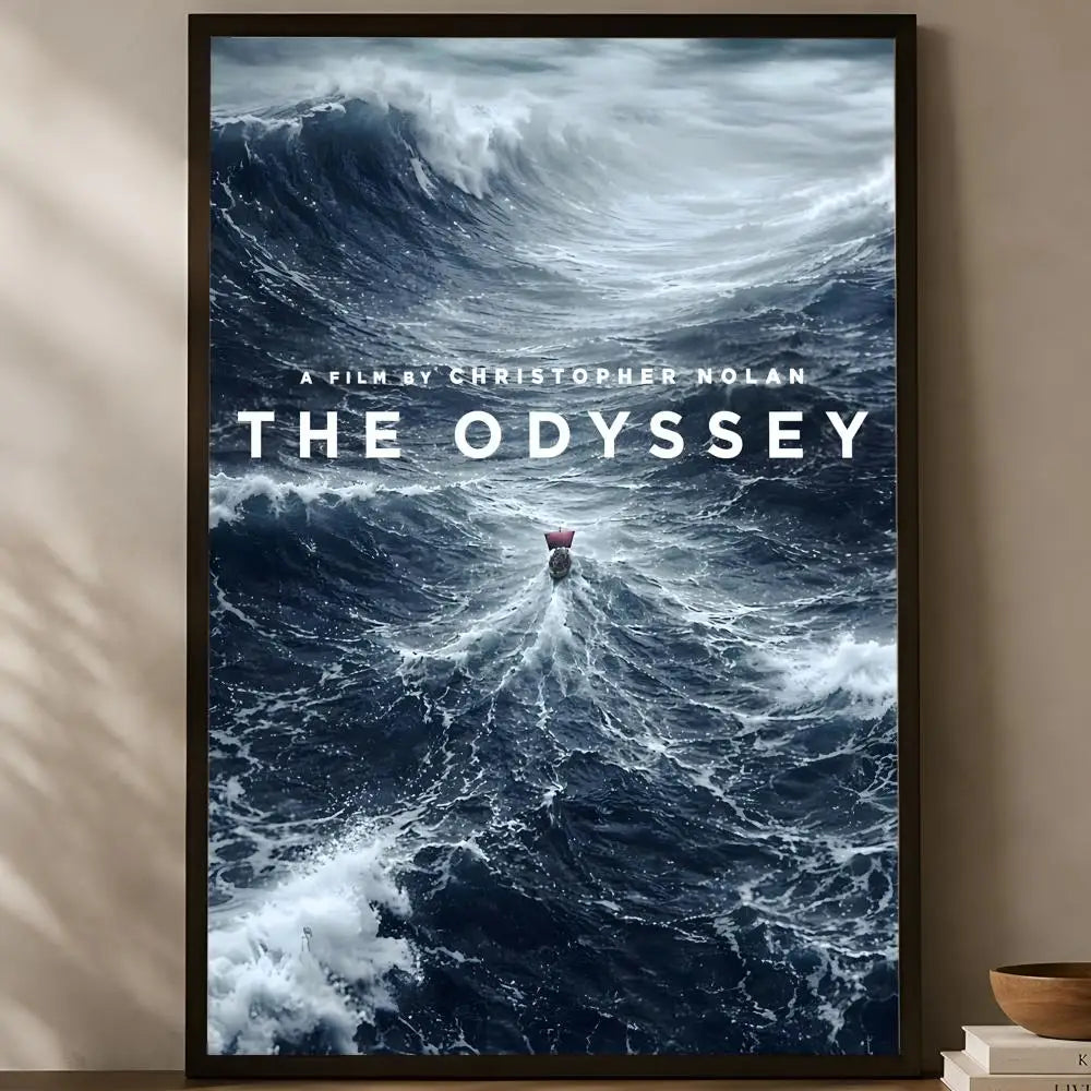 The Odyssey Christopher Nolan cinematic aerial view tiny red-sailed Greek ship dwarfed by massive crashing ocean waves poster displayed on a warm natural light shelf — LivDecor
