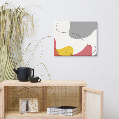 Warm Tide abstract canvas print in 16×20 hung above a rattan cane cabinet styled with a black ceramic tea set and dried pampas grass in a warm boho living space — LivDecor
