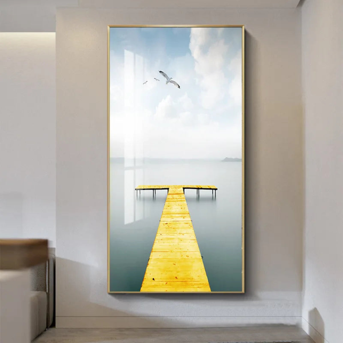 Yellow wooden dock extending over a misty lake minimalist canvas wall art in a gold frame with seagulls in a soft grey sky — LivDecor
